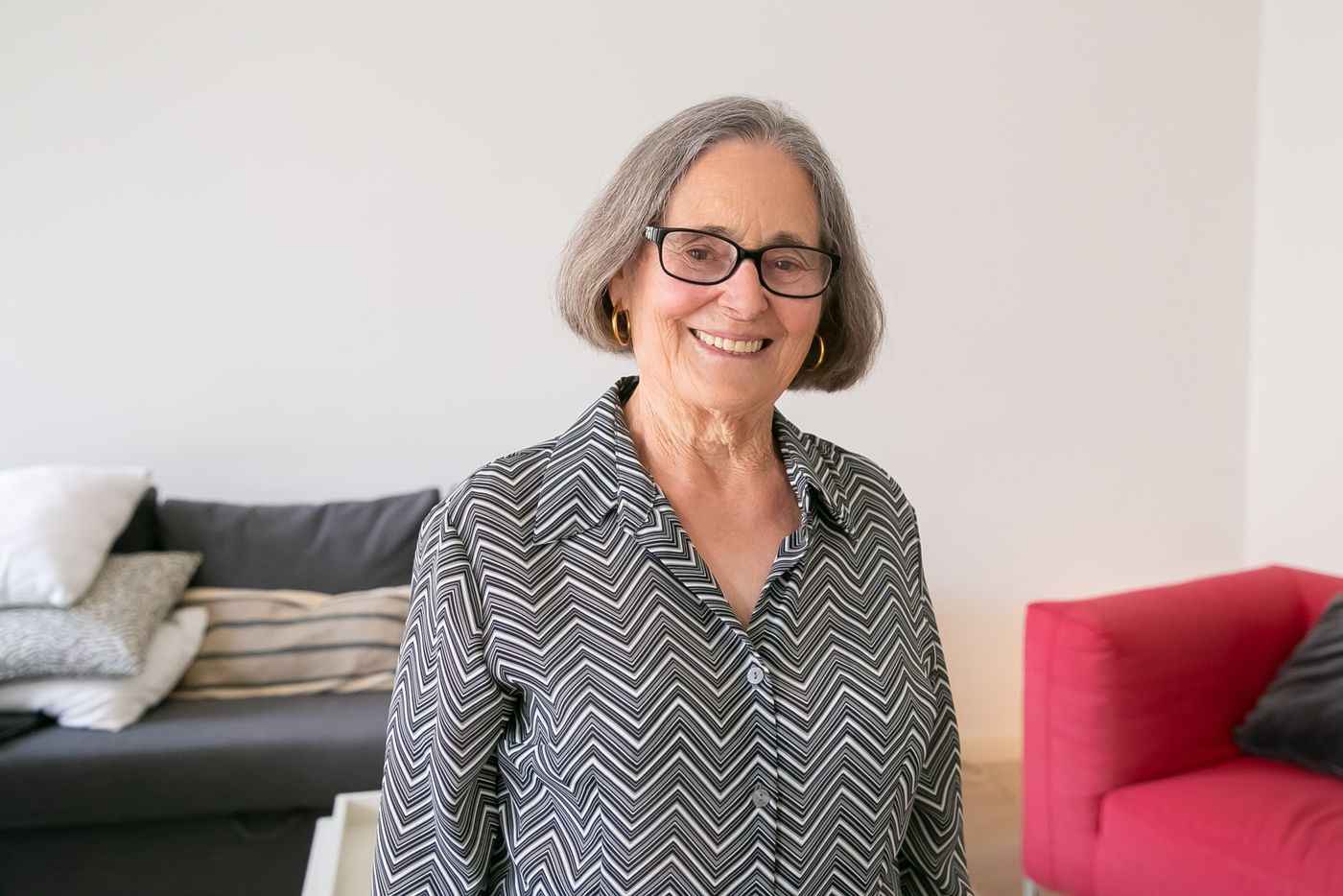 An older woman in her living room; illustrative photo
